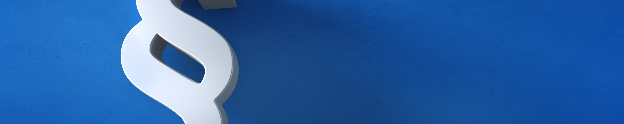 Paragraphen-Symbol vor blauer Wand.