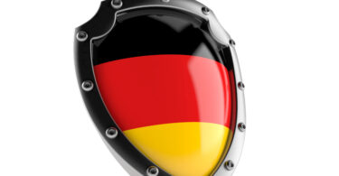 Shield with german flag isolated on white background.