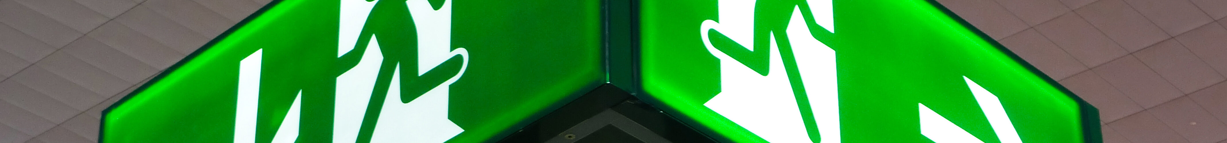 Emergency exit sign, cube light on ceiling.