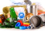 Recyclable garbage consisting of glass, plastic, metal and paper isolated on white background.