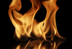 Soft Fire flame reflected on black background.