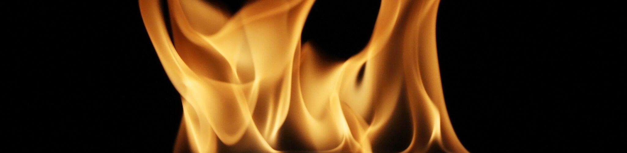 Soft Fire flame reflected on black background.