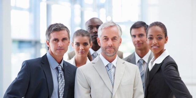 Portrait of a confident proud business group standing together.